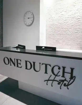 a one buffet counter with a clock on a wall at One Dutch Hotel in New York