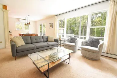a living room with a couch and two chairs and a table at Hudson Valley Haven - NY in Red Hook