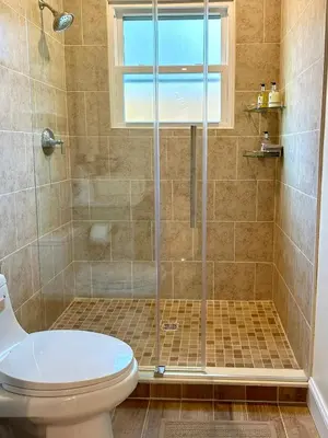 a bathroom with a shower with a toilet at Saugerties Waterfront Getaway in Saugerties
