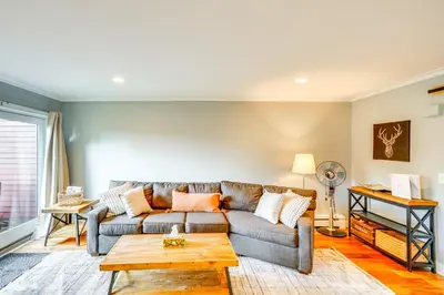 a living room with a couch and a table at Mtn and Foliage Views Modern Mount Snow Stay! in Dover