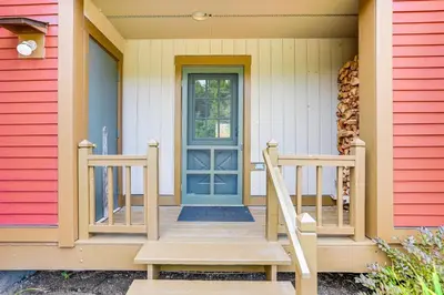 a front door of a house with a blue door at Mtn and Foliage Views Modern Mount Snow Stay! in Dover