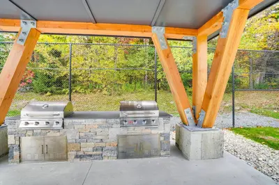 a patio with a grill and a grill at Mtn and Foliage Views Modern Mount Snow Stay! in Dover