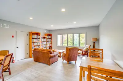 a living room with chairs and a table at Mtn and Foliage Views Modern Mount Snow Stay! in Dover