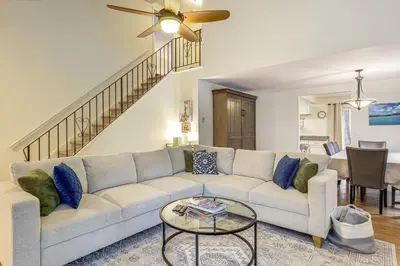 a living room with a couch and a table at Upstate Winter Escape! 2 Mi to GlobalFoundries in Malta