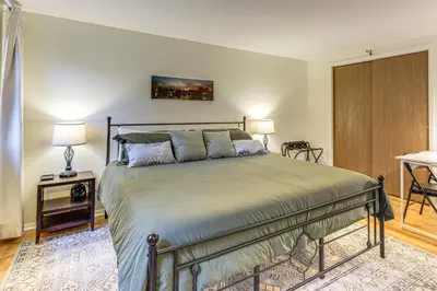 a bedroom with a large bed in a room at Upstate Winter Escape! 2 Mi to GlobalFoundries in Malta