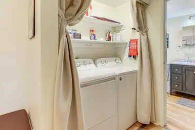 a kitchen with a washer and dryer in a room at Upstate Winter Escape! 2 Mi to GlobalFoundries in Malta