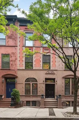 a building with a tree in front of it at Harlington by Rove Travel Private Backyard & Roof in New York