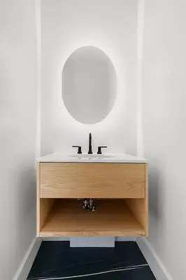 a bathroom with a sink and a mirror at Harlington by Rove Travel Private Backyard & Roof in New York