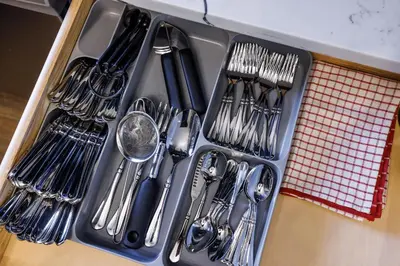a tray of utensils sitting on top of a table at Ultimate Urban living at Centrally Located Apartments in New York