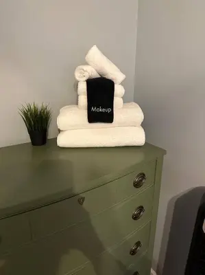 a stack of towels sitting on top of a dresser at SRC-Hudson Valley, Berkshires Cultural Corridor in Canaan