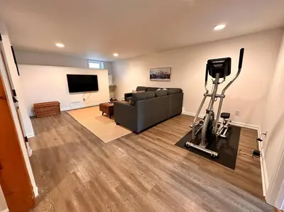 a living room with a couch and a flat screen tv at SRC-Hudson Valley, Berkshires Cultural Corridor in Canaan