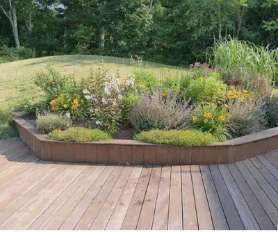 a garden with many different plants in a wooden deck at SRC-Hudson Valley, Berkshires Cultural Corridor in Canaan