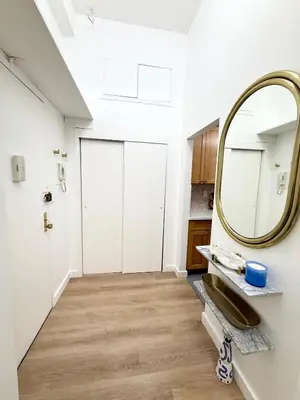 a bathroom with a mirror and a sink at GREAT APT 2 BED ROOM GREAT LOCATION nye in New York