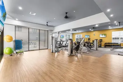 a gym with treadmills and machines in a room at Jersey City's Best Enjoy Our Deluxe 1 Bedroom Condo Only 25 Minutes to NYC in Jersey City