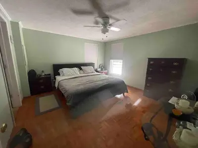 a bedroom with a bed and a ceiling fan at Most relaxing place on earth in Livingston Manor