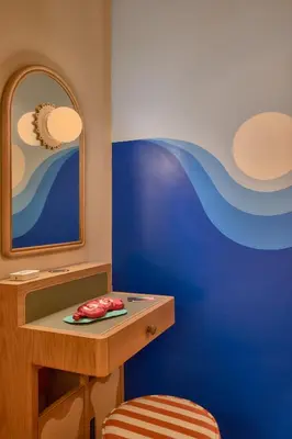 a dressing room with a table and a mirror at Now Now NoHo in New York