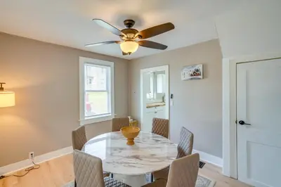 a dining room with a table with chairs and a ceiling fan at 2 Mi to Windham Mountain Scenic Home with Fire Pit! in Windham