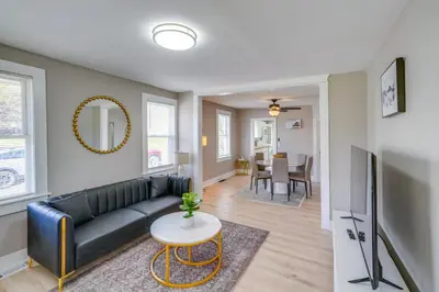 a living room with a couch and a table at 2 Mi to Windham Mountain Scenic Home with Fire Pit! in Windham