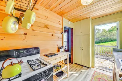 a kitchen with a stove with a tea kettle on it at Pet-Friendly Catskills Retreat Fire Pit and Deck! in Grand Gorge