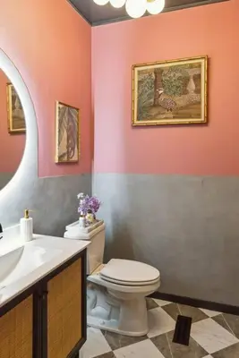 a bathroom with a toilet and a sink at Unique Fully Restored Landmark Barn in Hudson in Claverack