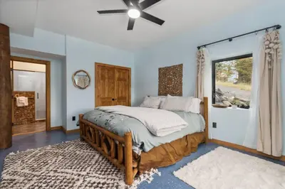 a bedroom with a large bed and a window at Snow Nirvana in Hunter