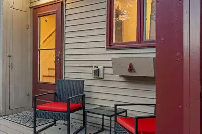 two chairs and a table in front of a house at Mt Snow Retreat - Walk to brewery in Dover