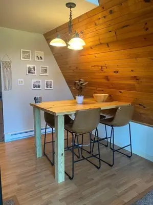 a dining room table with chairs and a wooden ceiling at Corner's Cabin - A-Frame - Catskills NY in South New Berlin