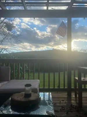 a view of a porch with an american flag at Corner's Cabin - A-Frame - Catskills NY in South New Berlin