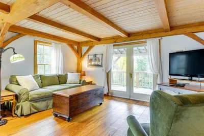 a living room with a couch and a tv at Home 15 Mi to Berkshire East and Mount Snow! in Whitingham