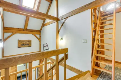 a staircase in a house with wooden beams at Home 15 Mi to Berkshire East and Mount Snow! in Whitingham