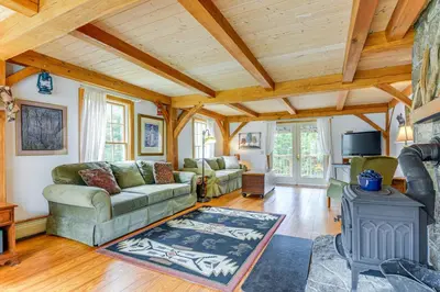 a living room with a couch and a fireplace at Home 15 Mi to Berkshire East and Mount Snow! in Whitingham