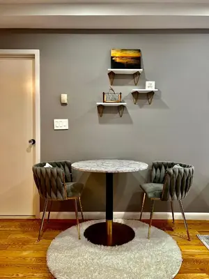 a table and two chairs in a room at Cozy apartment in New York in Woodside