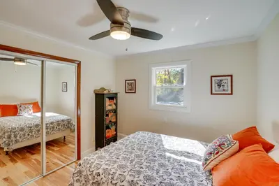 a bedroom with a bed and a window at 1 Mi to Dtwn Cottage with Large Yard in Stockbridge in Stockbridge