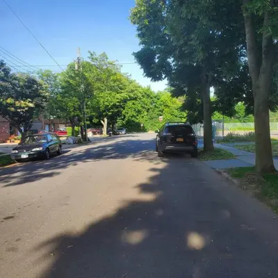 a car parked on the side of a street at Adorable 2 Bedrooms in Bellerose NY in Bellerose