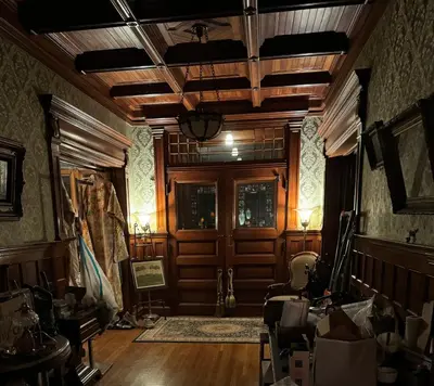 a room with a wooden door and wooden floors at Haslett House - A Gilded Age Estate in Fort Plain