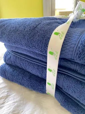 a pile of blue towels stacked on top of each other at 3-bedrooms Journal Square near NYC in Jersey City