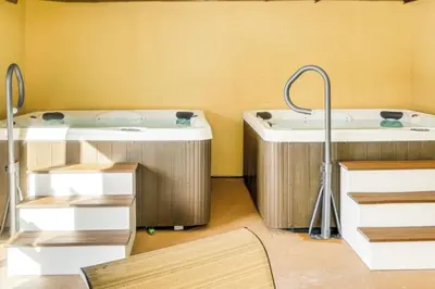 two jacuzzi tubs in a bathroom with yellow walls at Snow Mountain Village 13F in Dover