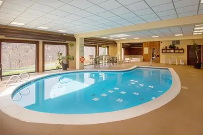 a large swimming pool in a large room at Snow Mountain Village 13F in Dover