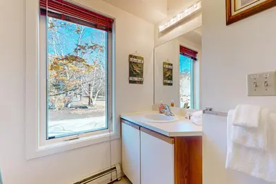 a bathroom with a sink and a window at Snow Mountain Village 13A in Dover