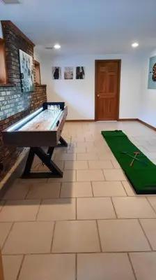 a large room with a ping pong table in it at Falcon's Nest, Lakefront at Byram Cove, Hopatcong in Andover