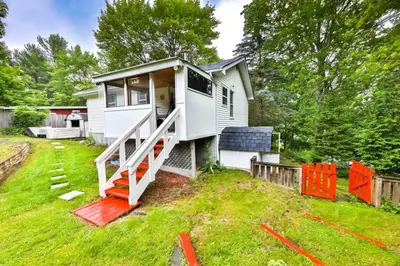 a tiny house is being built in a yard at Hunter Hideaway with Hot Tub in Lanesville