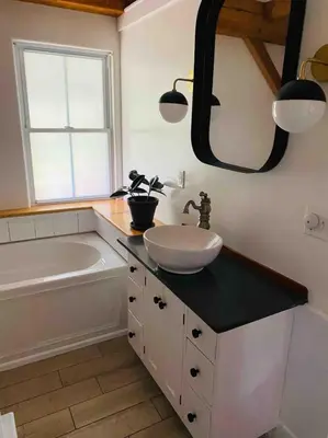 a bathroom with a sink and a bath tub and a sink at Private Woodland Retreat with Cedar Hot Tub & Mt View in Gilboa