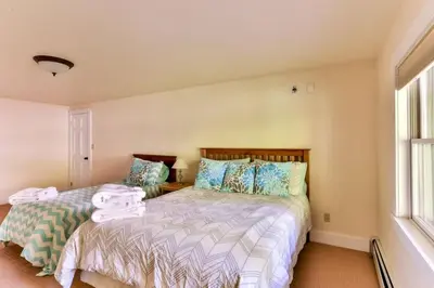 a bedroom with two beds and a window at Country Escape Overlooking Hunter & Windham Mts in Jewett