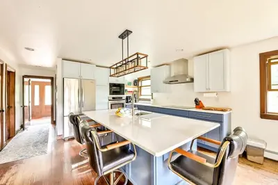 a kitchen with a large white table and chairs at Dog-Friendly Mountain Hideaway in Jewett