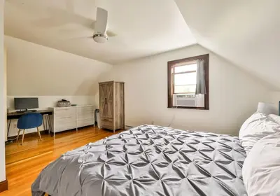 a bedroom with a bed and a window and a desk at Dog-Friendly Mountain Hideaway in Jewett