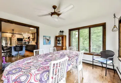 a dining room with a table and chairs at Dog-Friendly Mountain Hideaway in Jewett