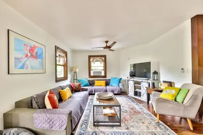 a living room with a couch and a table at Dog-Friendly Mountain Hideaway in Jewett