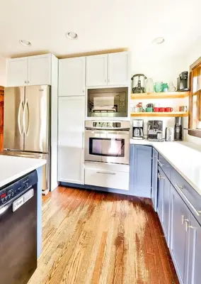 a kitchen with white cabinets and stainless steel appliances at Dog-Friendly Mountain Hideaway in Jewett