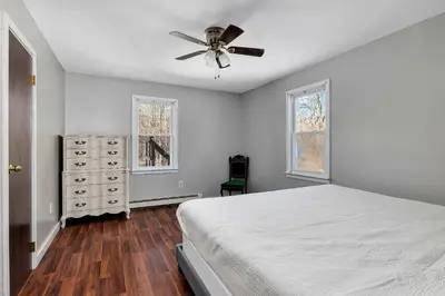 a bedroom with a bed and a ceiling fan at High Falls Hideout in Catskill