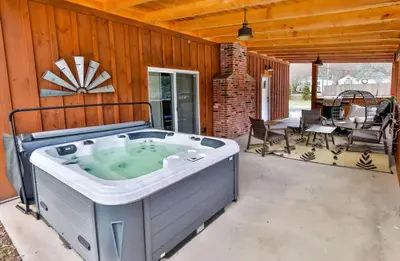 a hot tub in the middle of a patio at Mountain Cabin with Scenic Views and Hot Tub in Windham